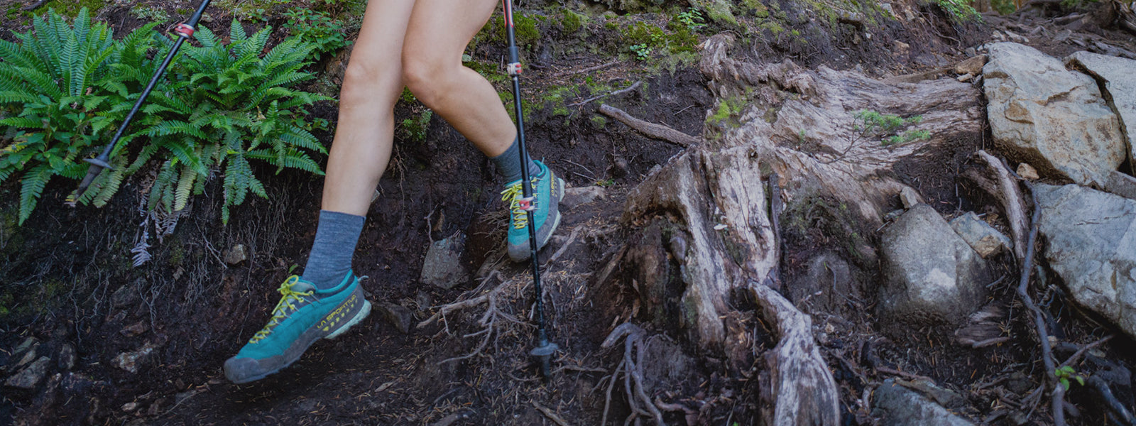 Woman hiking, wearing FLITE XT TRAIL Five socks