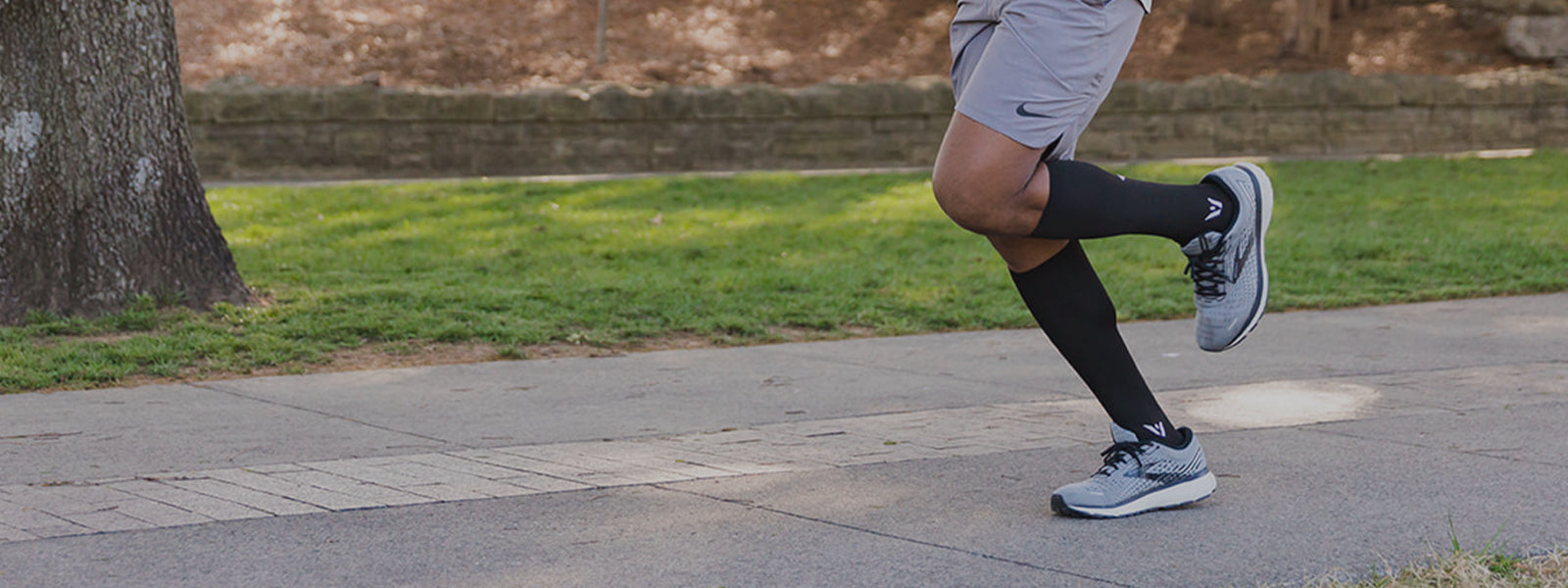 Man running, wearing ASPIRE Twelve Knee-High Socks