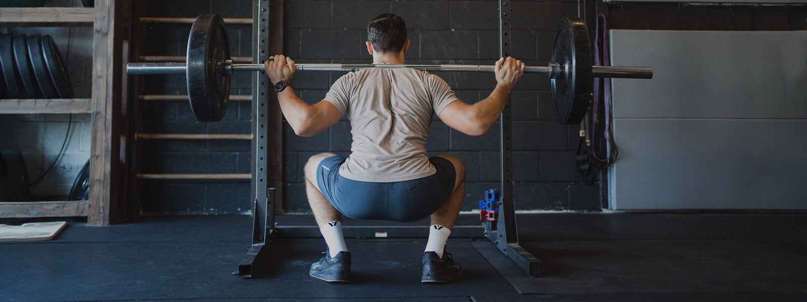 Men's Fitness Socks header image, man lifting weights