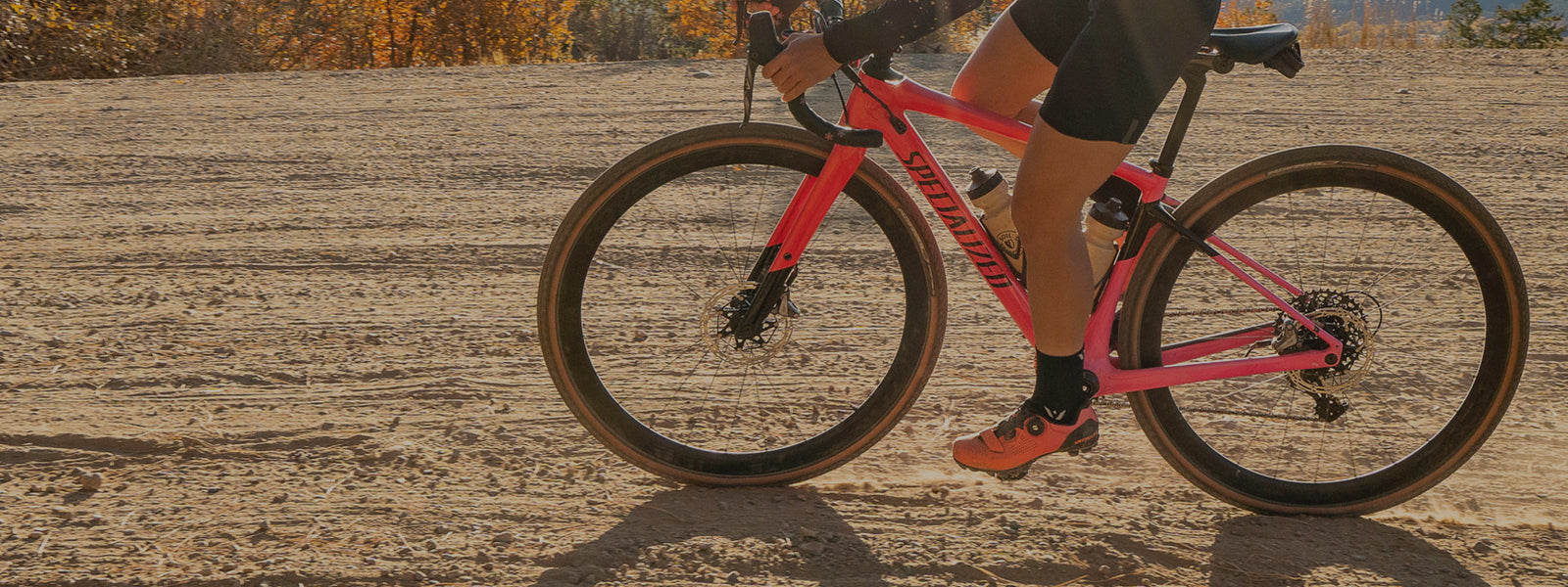 Swiftwick PERFORMANCE Socks header image, person cycling wearing PERFORMANCE Four socks