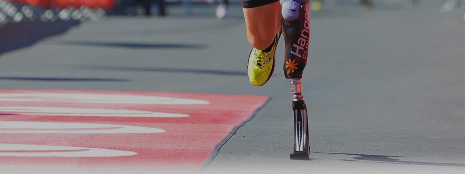 Adaptive/Amputee Socks Header Image, Man running with prosthetic leg