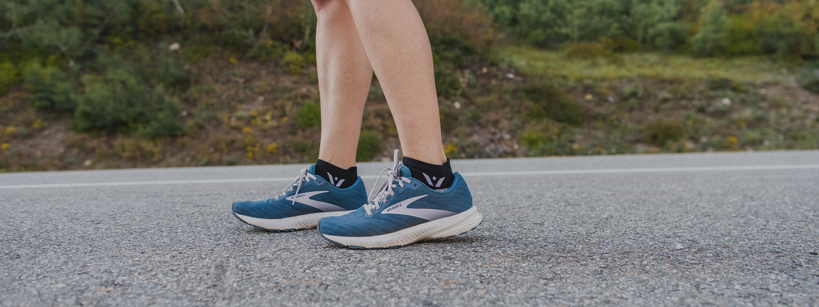 Woman running, wearing FLITE XT Zero socks