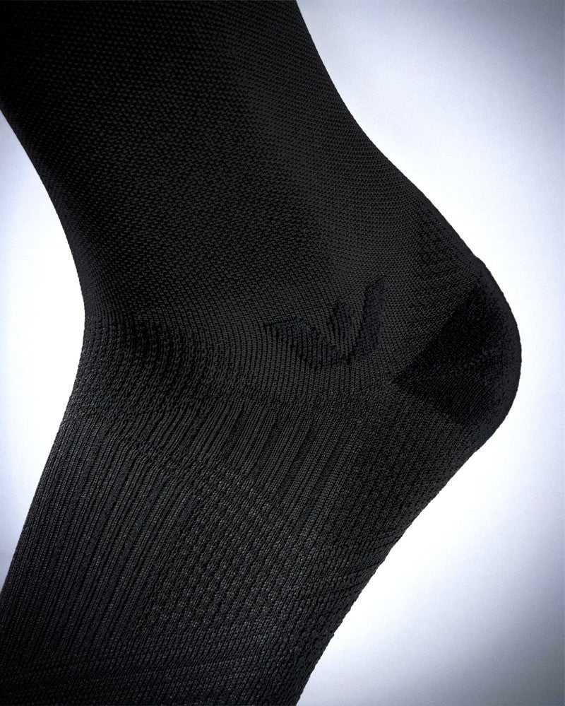 Black sock on a light gray background