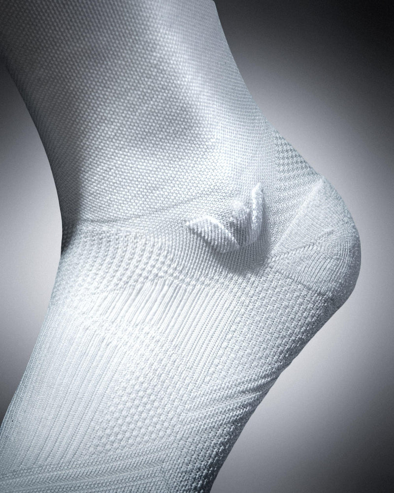 Close-up of a white sock on a gray background