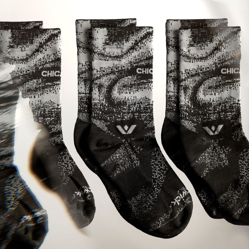 Three pairs of Chicago Mid-Crew socks on a white background