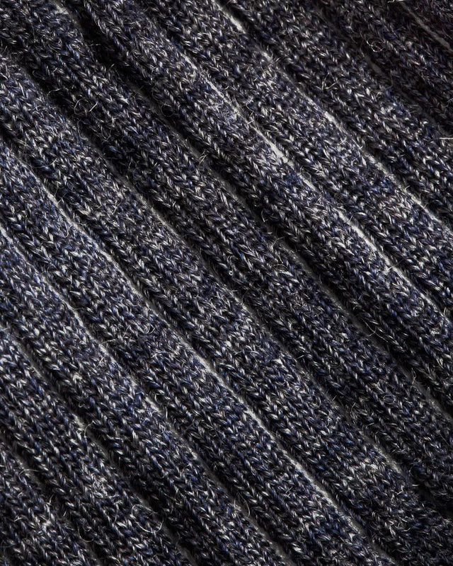 Closeup of slate blue knit sock textile