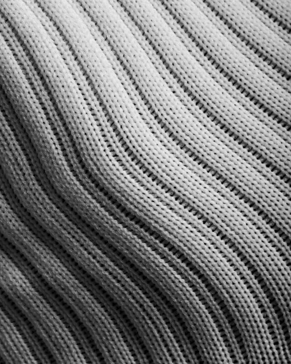 Closeup of white knit sock textile detail